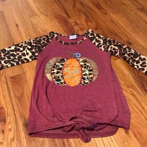 Girl pumpkin top toes at the bottom